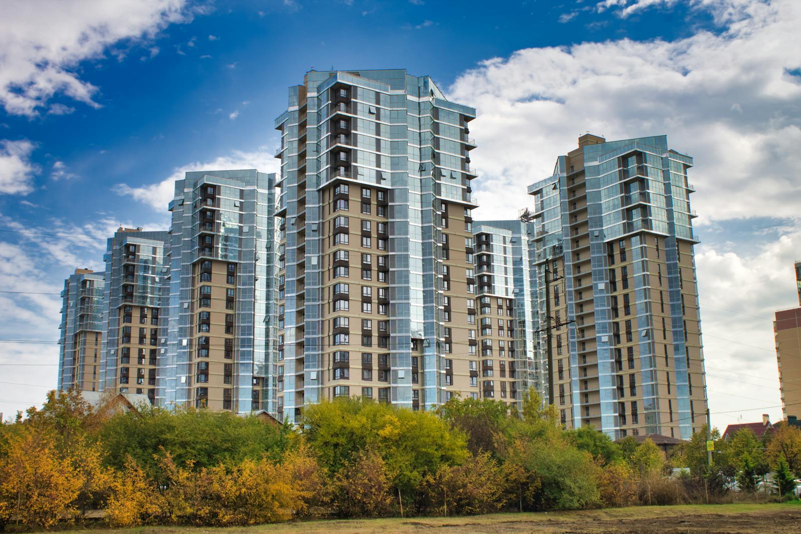 Modern high-rise residential towers with reflective glass façades